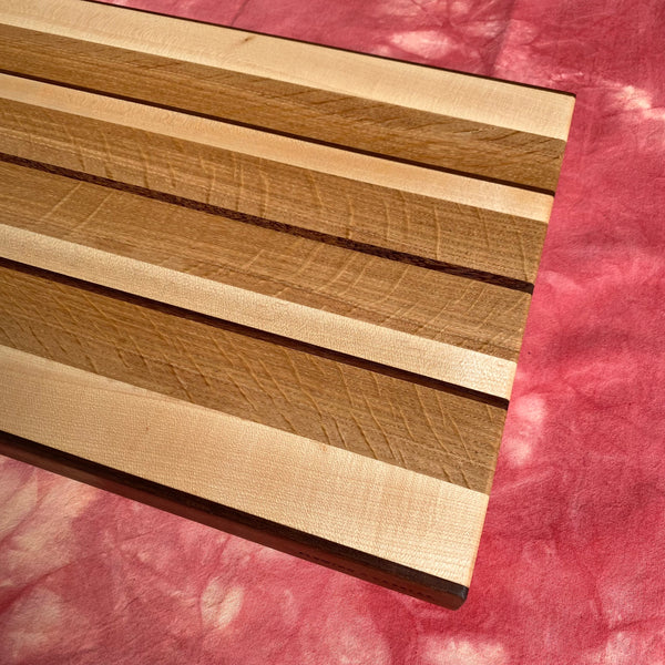 striped bookmatched white oak black walnut and maple striped hardwood cutting board